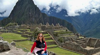 Woman sits at Machu Picchu