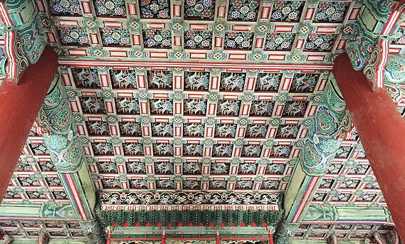 Intricate details on the ceiling of a South Korean structure.