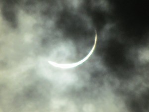 Cloudy picture of eclipse nearing totality