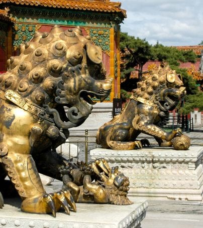 Lion statues in front of building in China