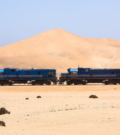 Train runs through desert near Swakopmund, Namibia