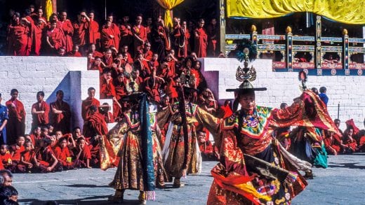 Performers and onlookers at festival in Thimphu, Bhutan