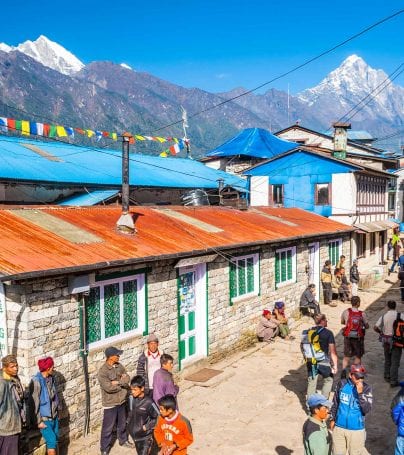 People wander street in Lukla, Nepal