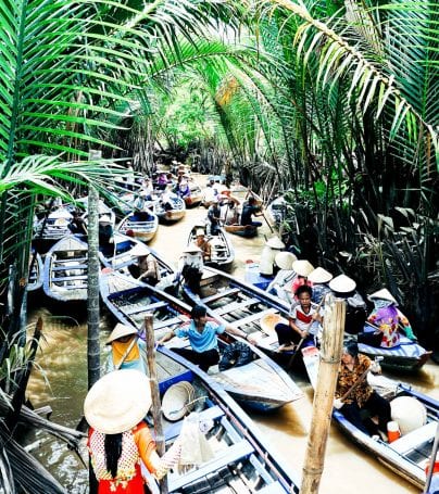 Group of boats travels on river of Mekong Delta