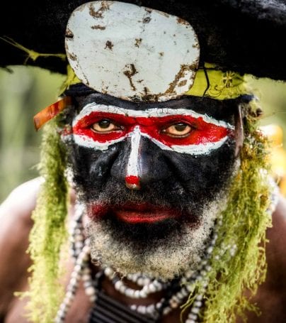 Man with painted face at Mount Hagen, Papua New Guinea