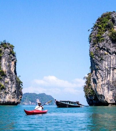 Traveler kayaks in Phuket, Thailand