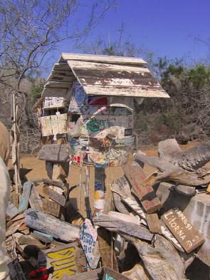 Explore 18th century Post Office Bay and mail a postcard to a friend