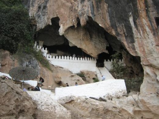 See the Buddha images at Pak Ou Caves