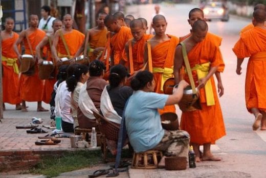 Join in offering alms to Buddhist monks