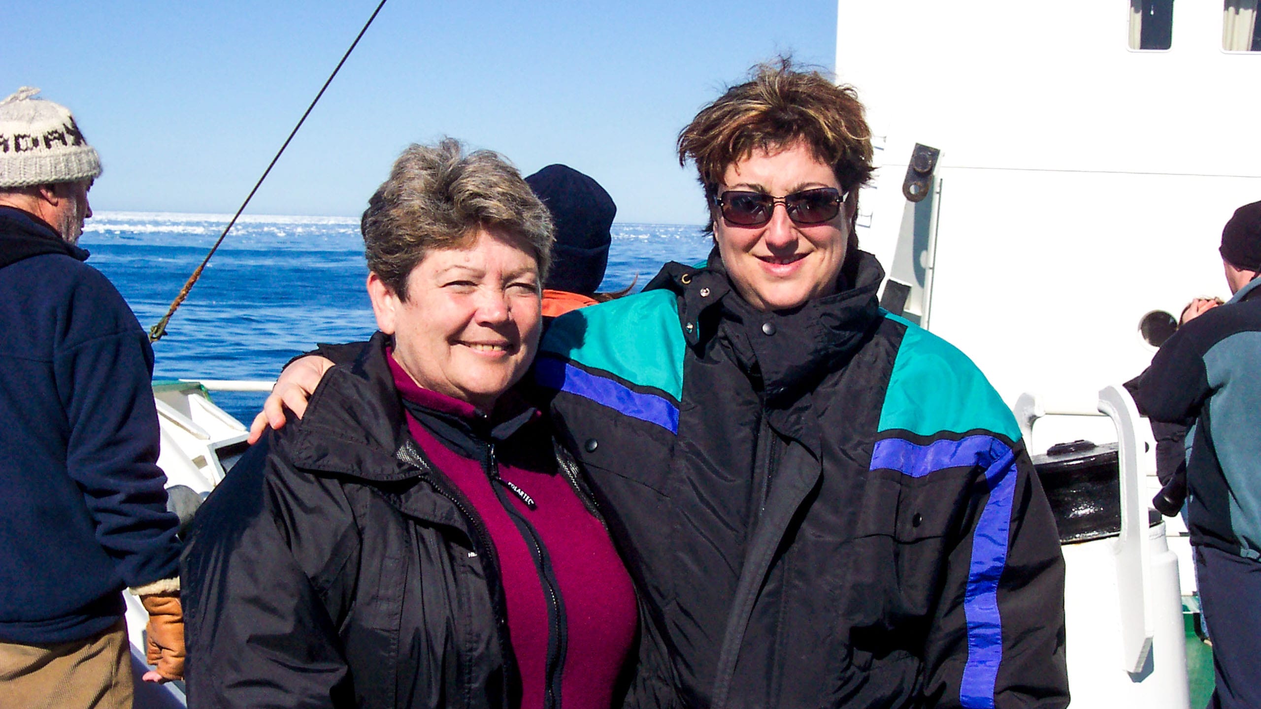 Women pose on ship during arctic trip