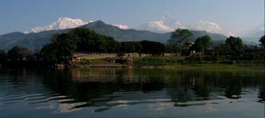 The Annapurna range looms above Phewa Lake