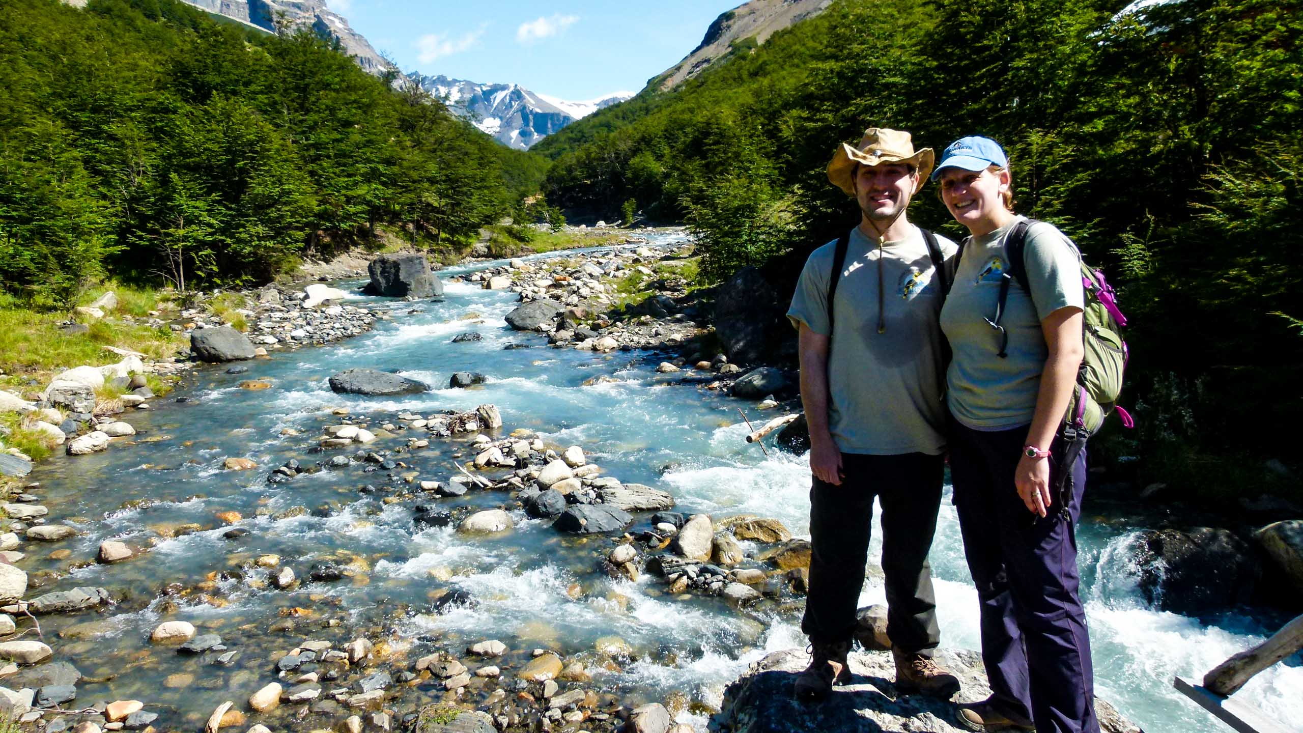 Hikers stand in Chile stream