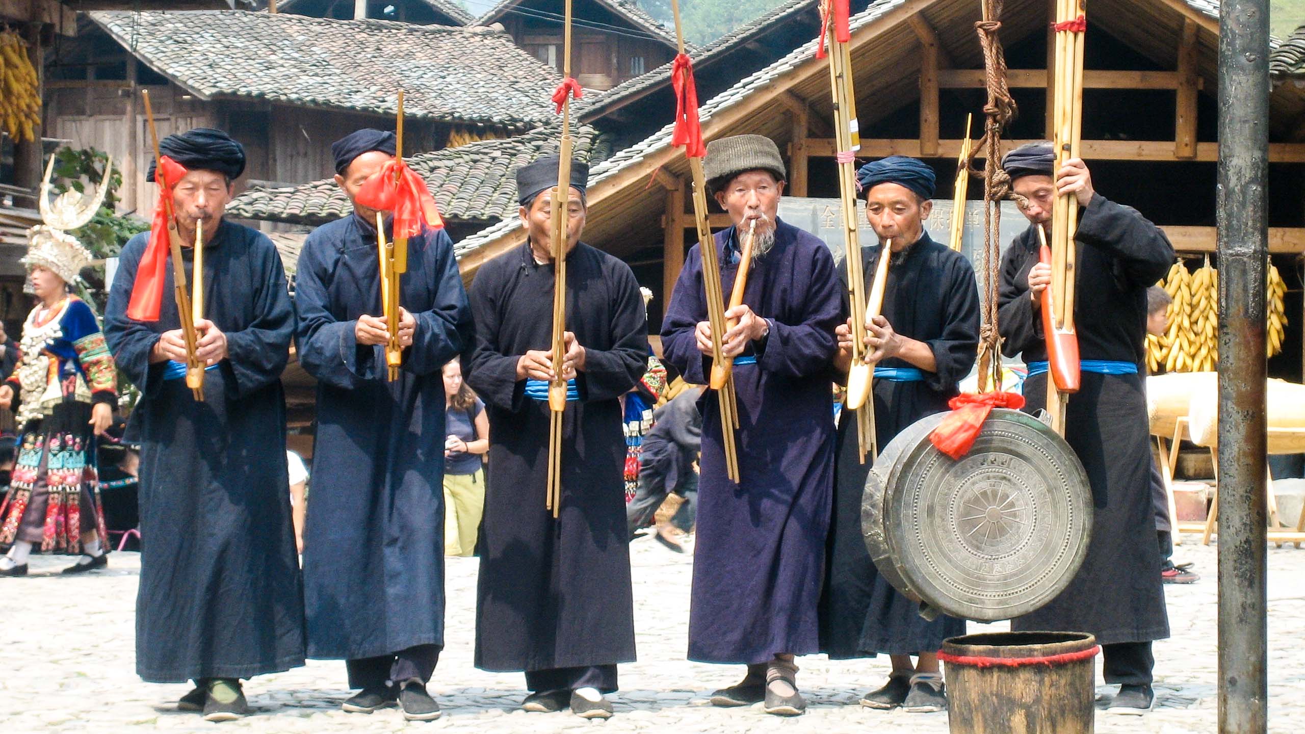 Chinese men play flutes