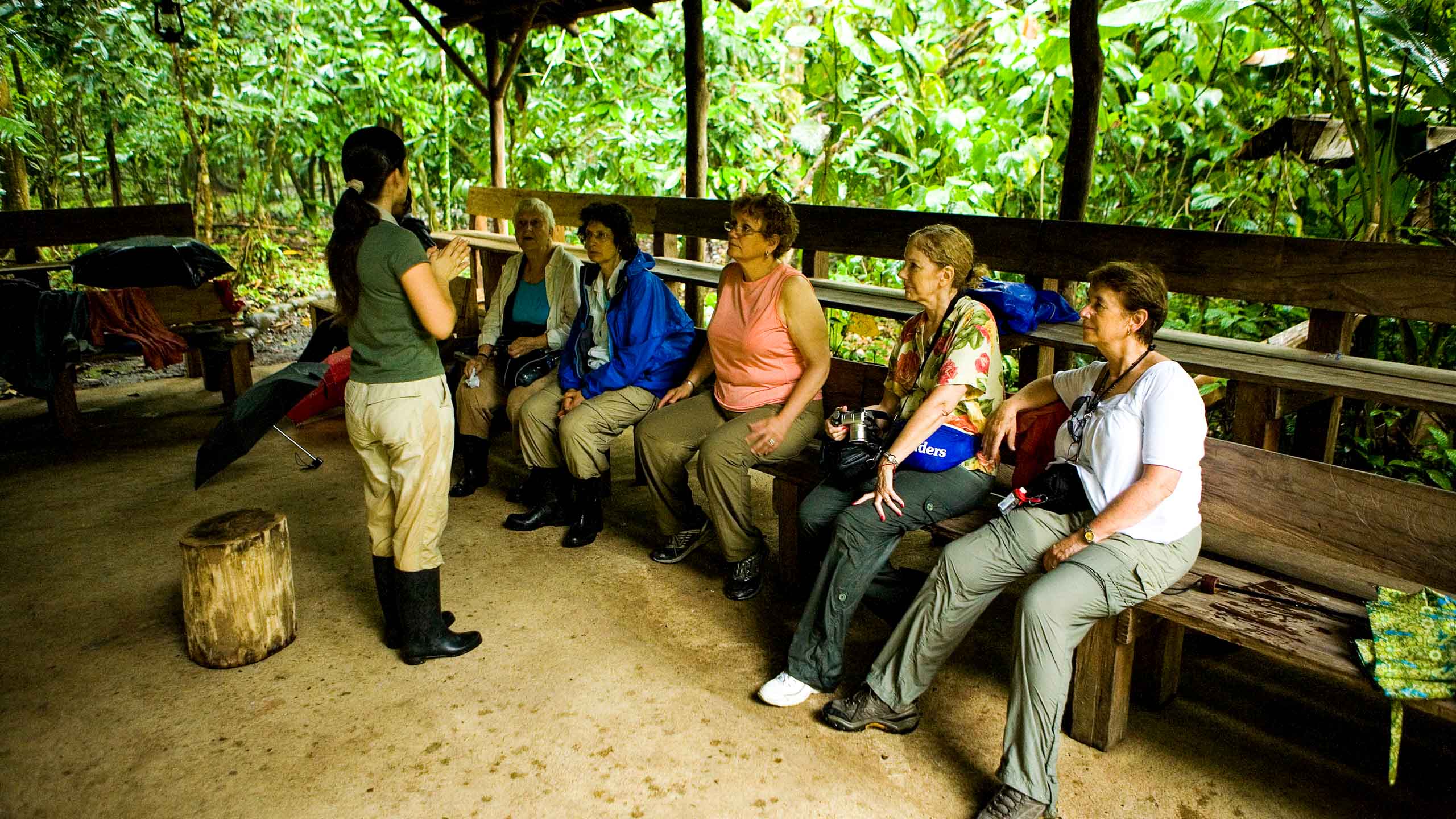 Tour guide speaks to group of travelers in Costa Rica