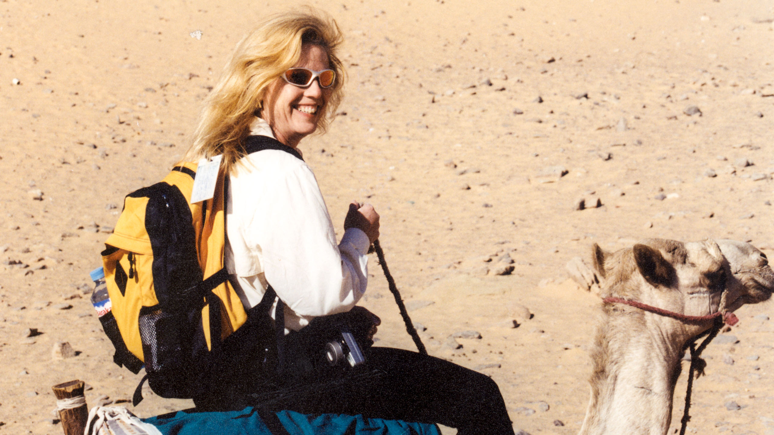 Woman riding camel on Egypt trip