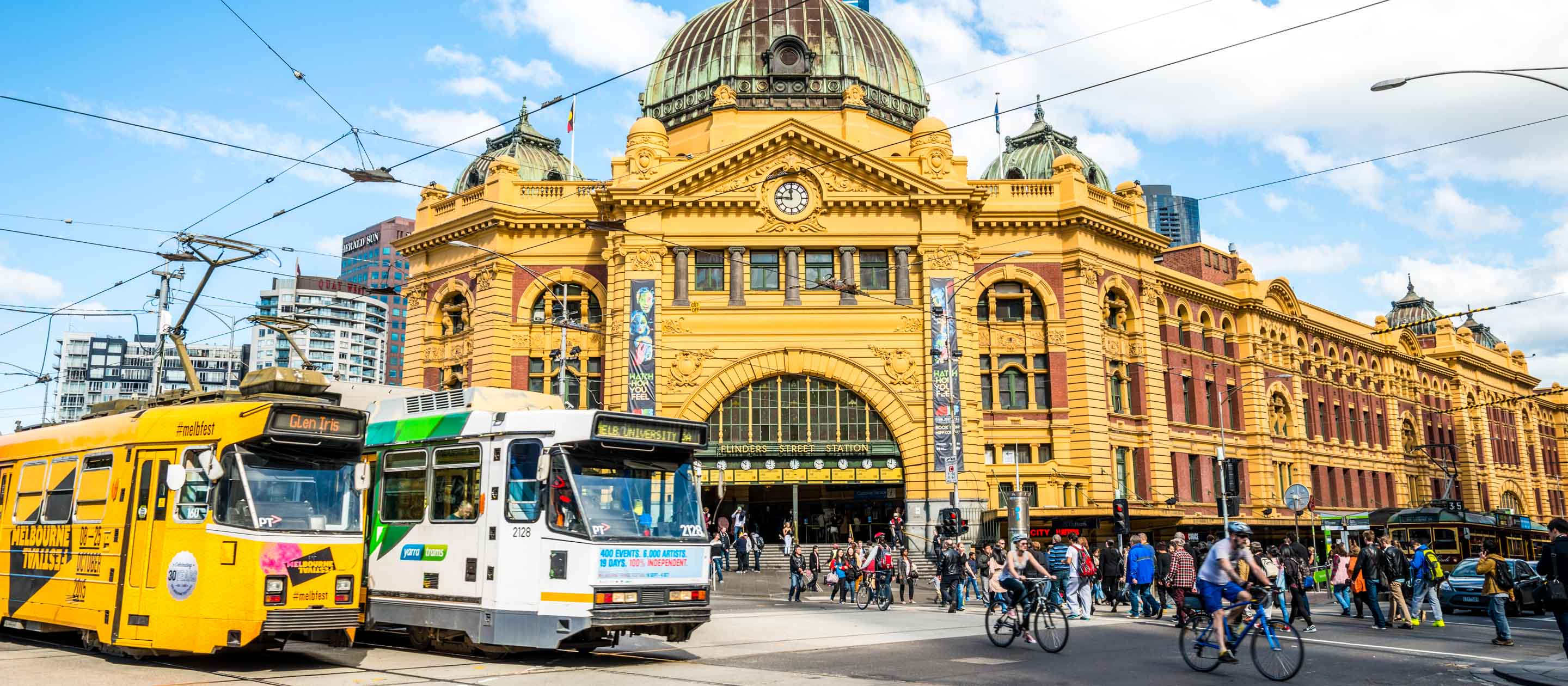 People and trains on Flinders Street in Melbourne, Australia