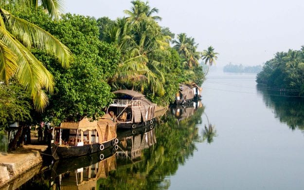 River boats docked on side of India river