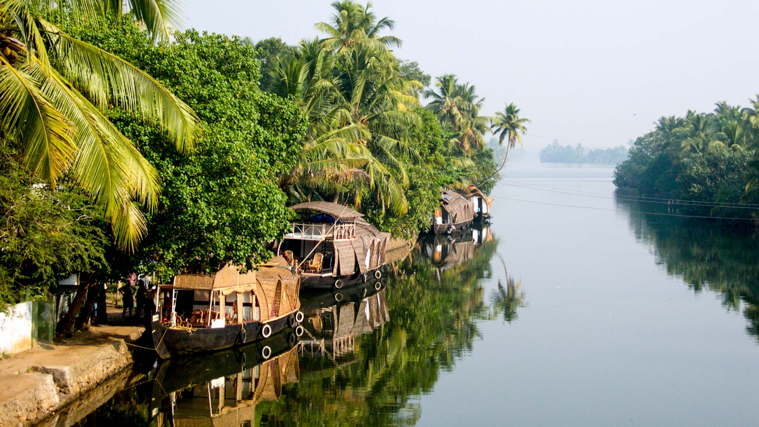 River boats docked on side of India river