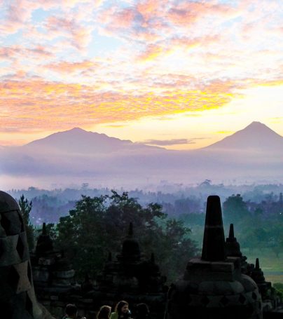 Yogyakarta monuments against misty Indonesia landscape