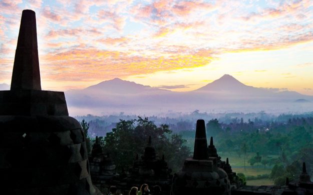 Yogyakarta monuments against misty Indonesia landscape