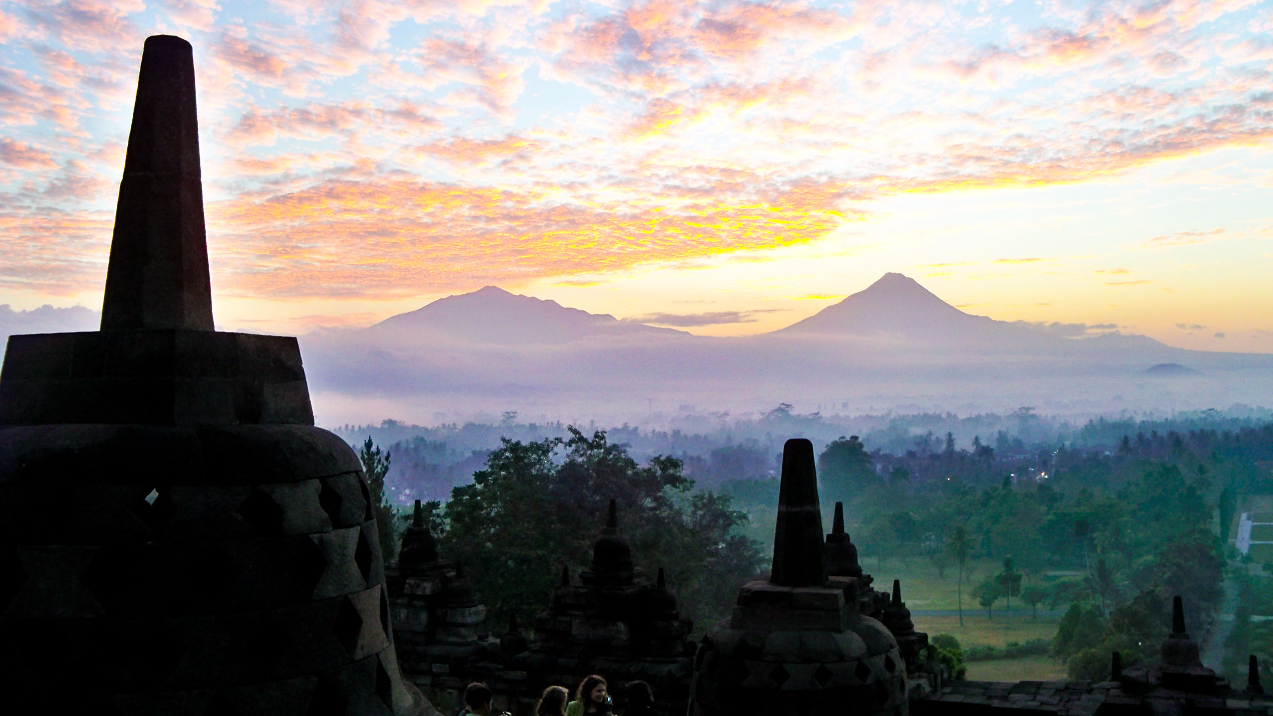 Yogyakarta monuments against misty Indonesia landscape