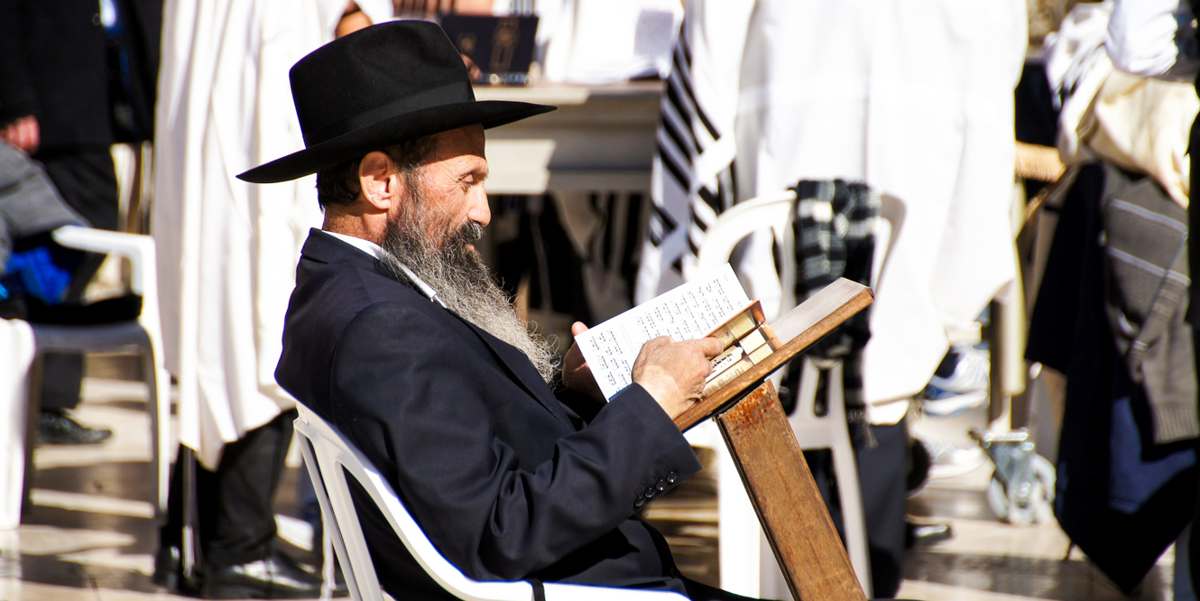 Jewish man reads in Jerusalem