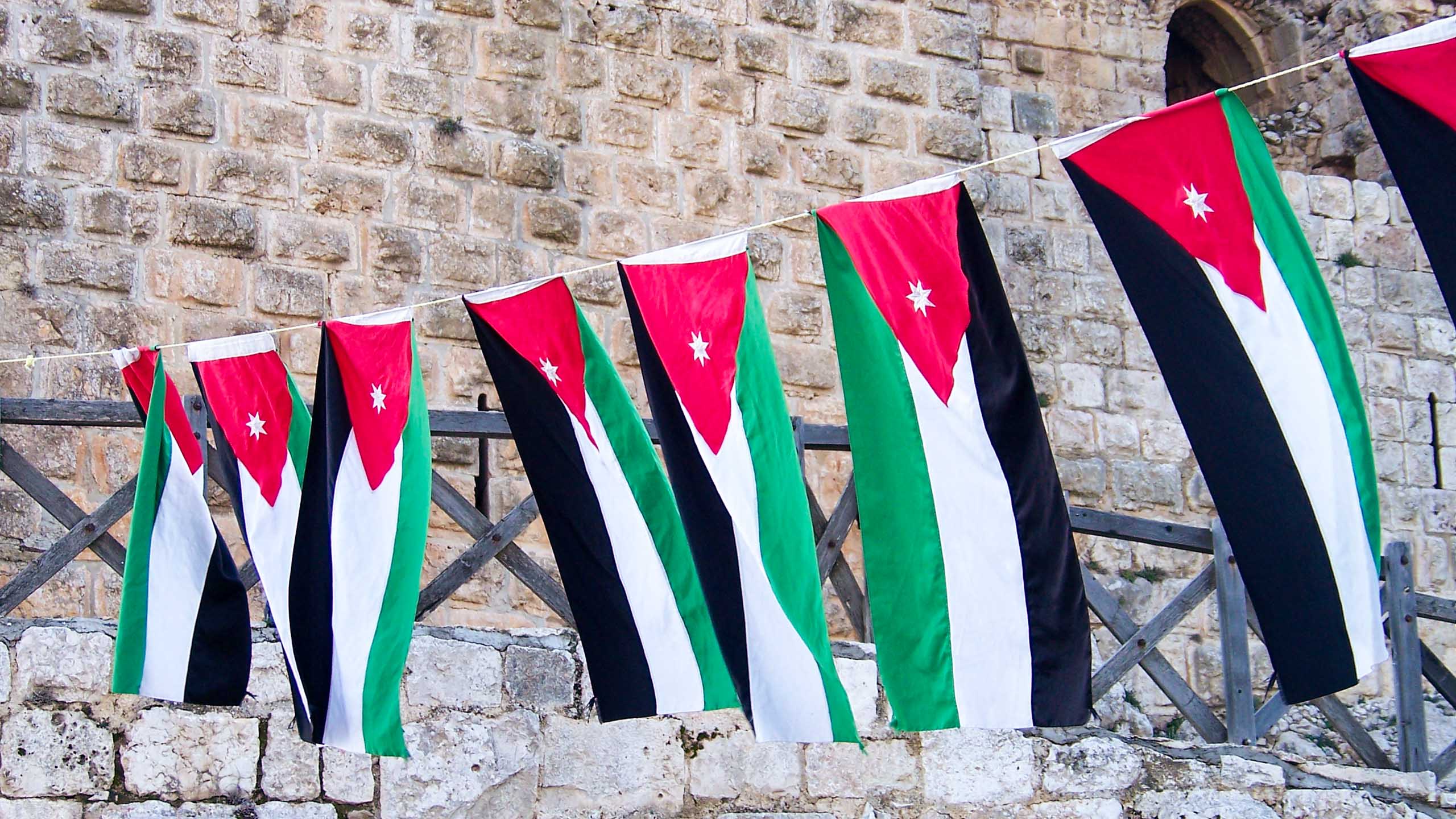 Jordan flags hanging between buildings