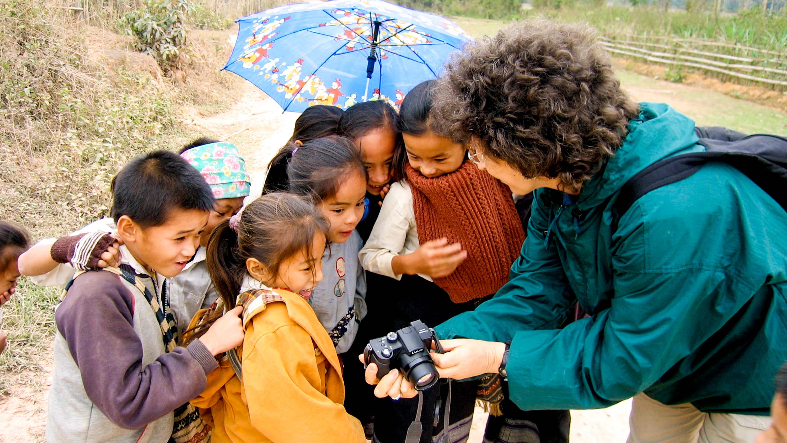 Group of Laos children look at traveler's camera