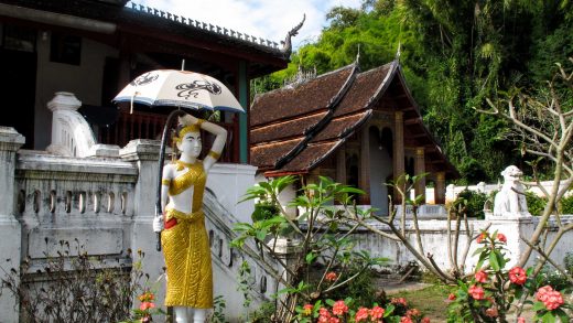 Statue in front of building in Laos