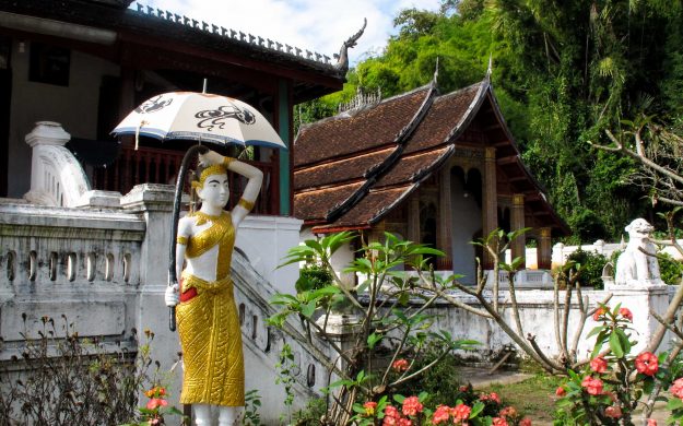 Statue in front of building in Laos