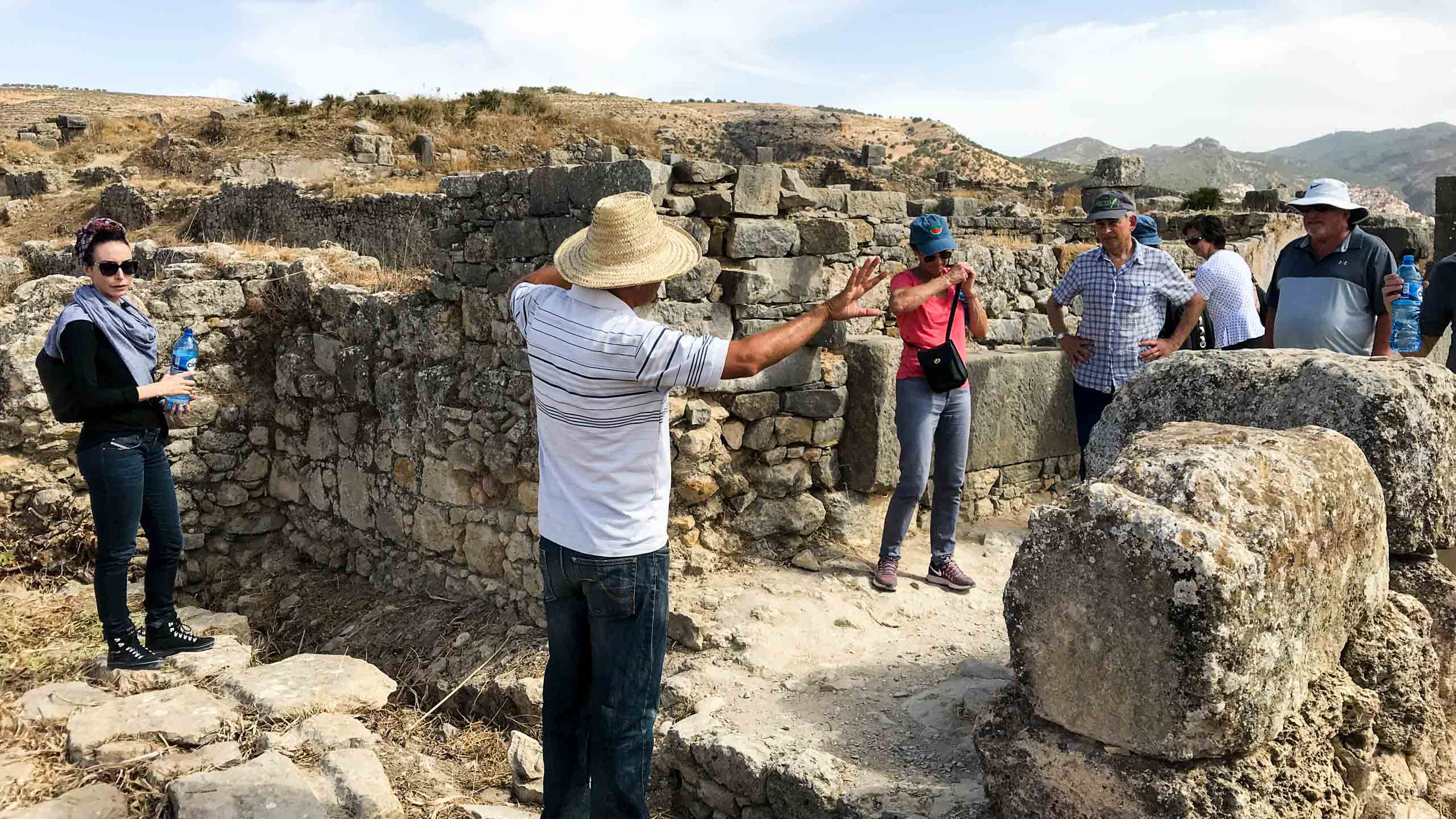 Tour group explores Morocco ruins