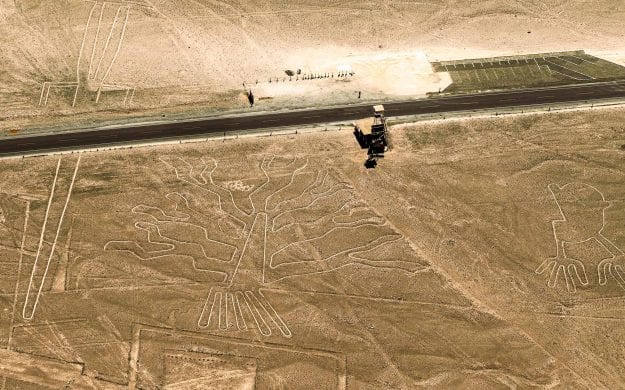 Desert road runs past Nazca Lines in Peru