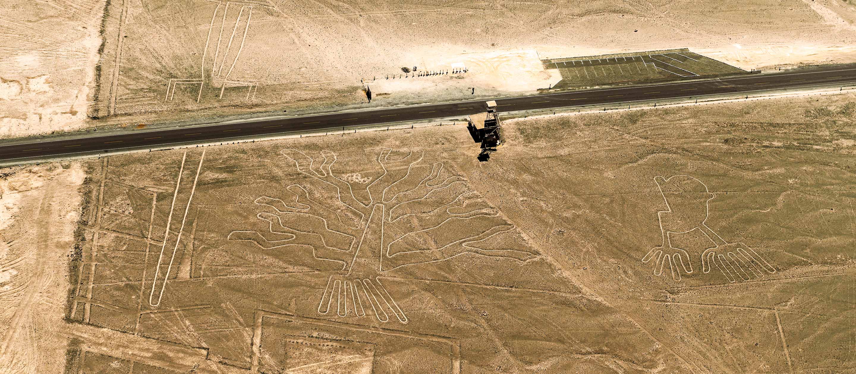 Desert road runs past Nazca Lines in Peru