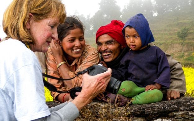 Woman shares digital photos with Nepal family