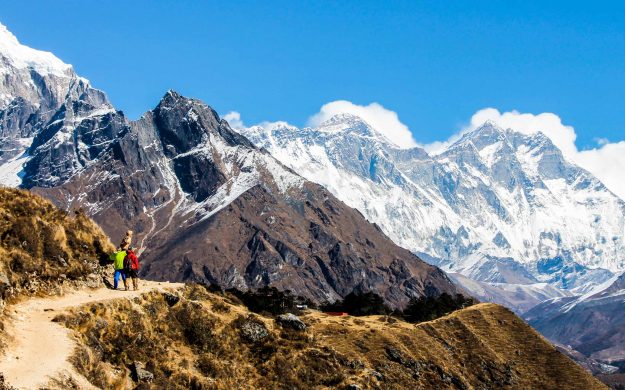 Hikers on trail in Nepal mountains