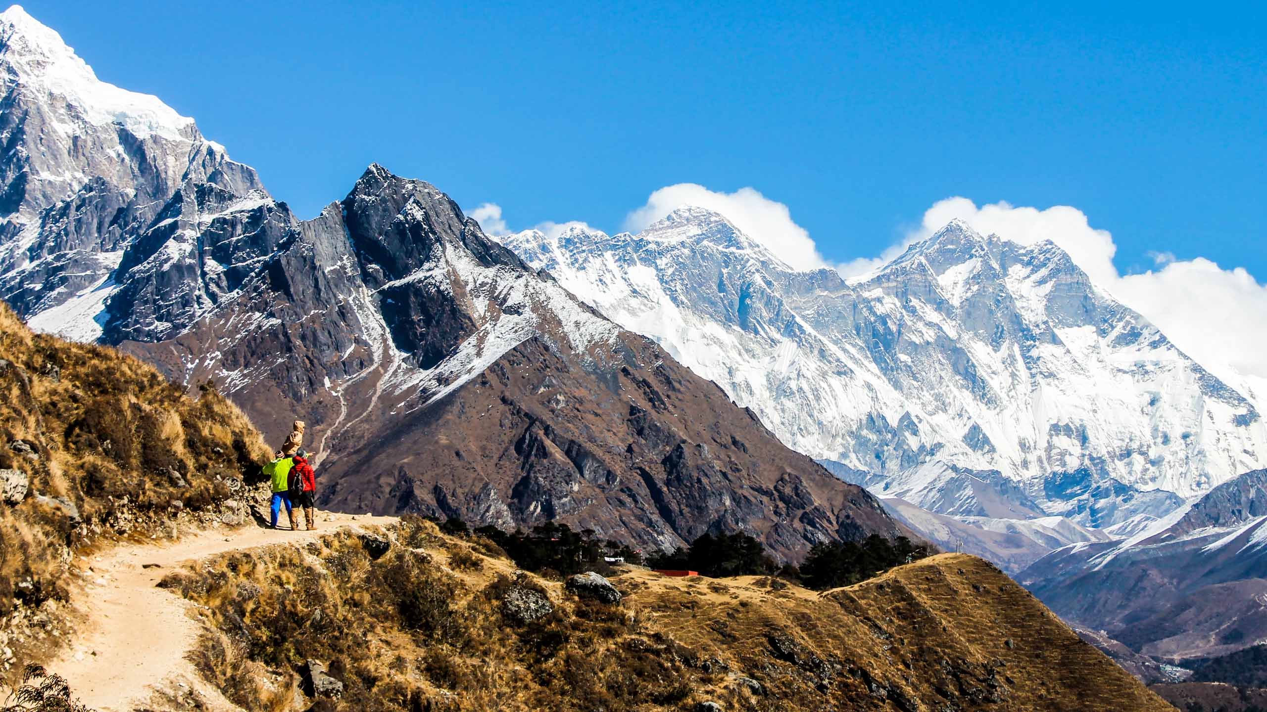 Hikers on trail in Nepal mountains