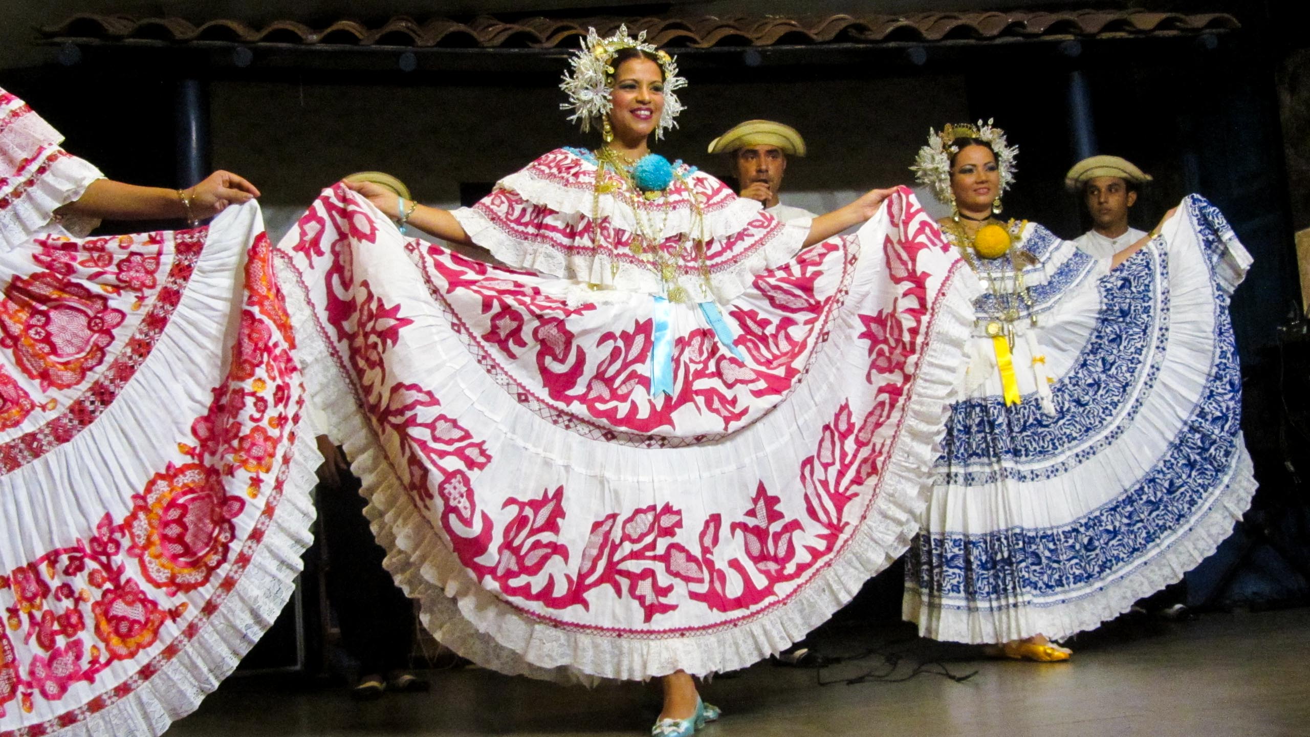 Panama women hold skirts wide while dancing