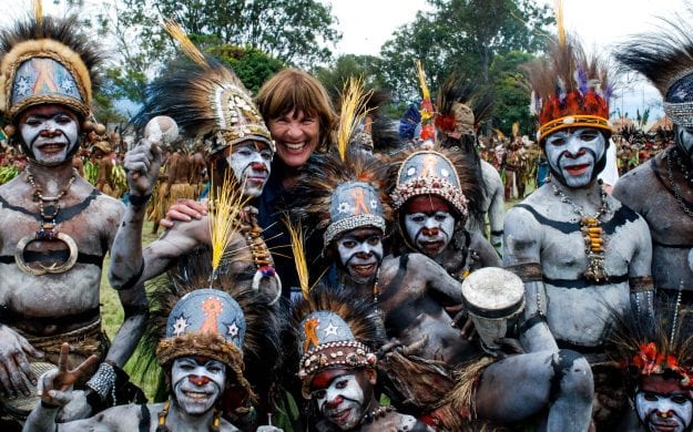 Traveler stands with Papua New Guinea tribe
