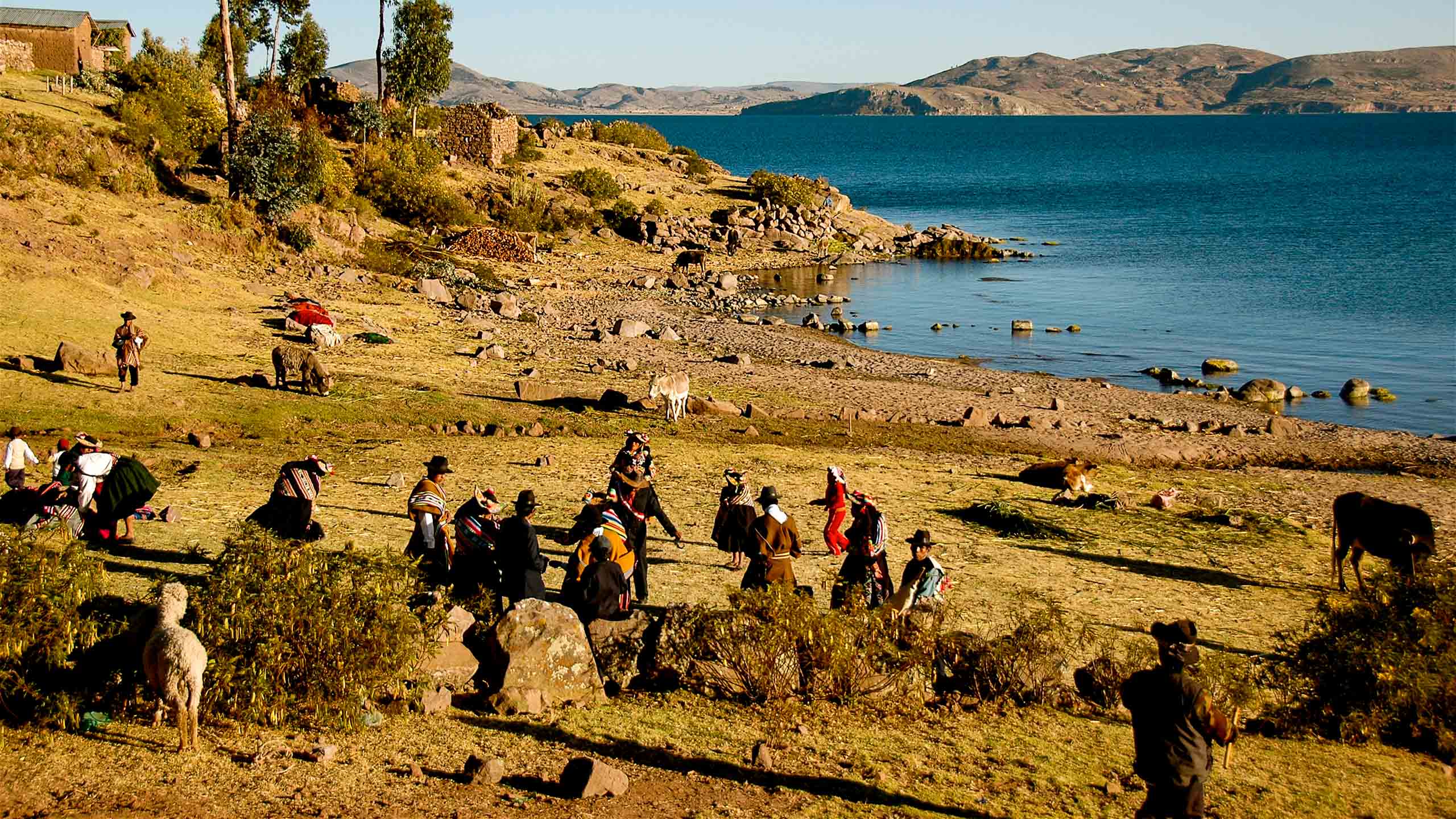 Peru people on plain near water