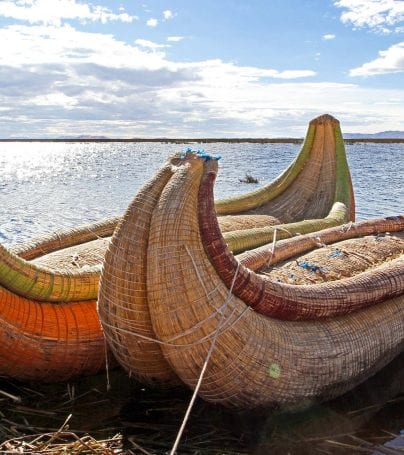 Straw canoes waiting on Peru shore