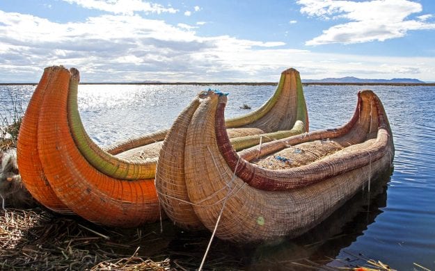 Straw canoes waiting on Peru shore