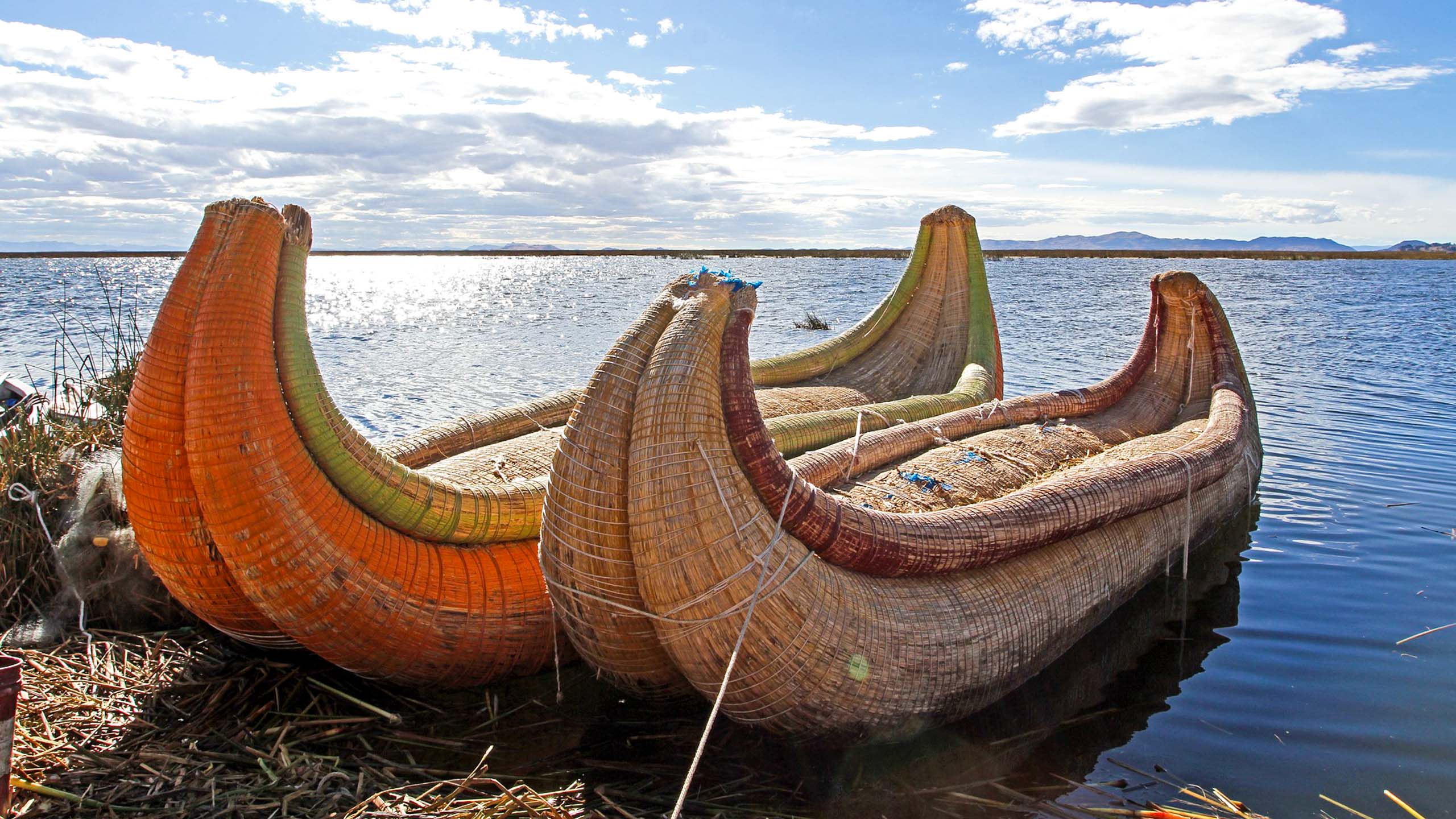Straw canoes waiting on Peru shore