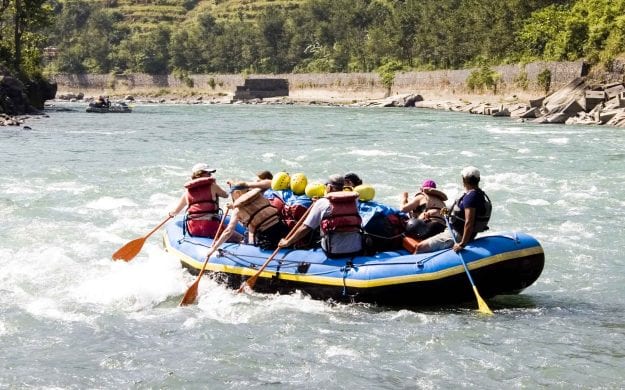 Group of travelers raft in Nepal