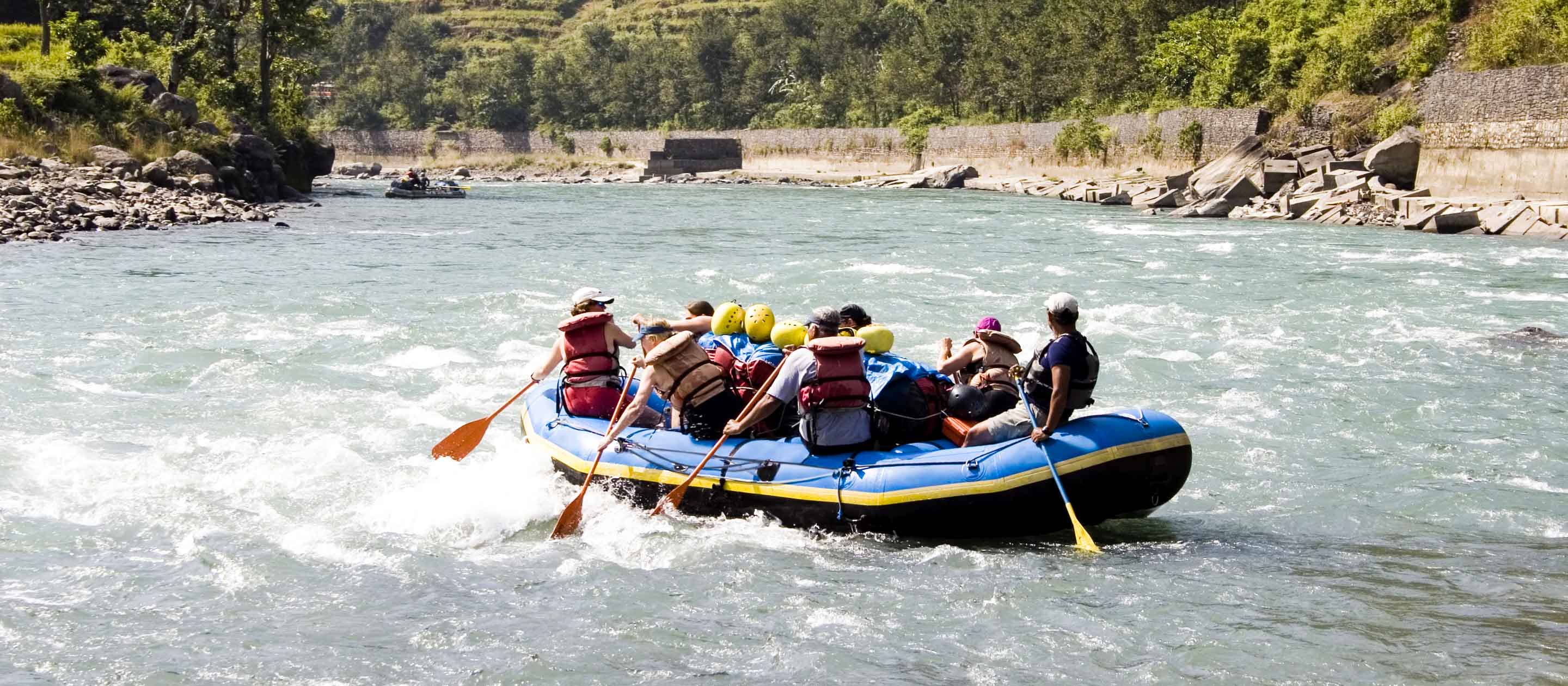 Group of travelers raft in Nepal