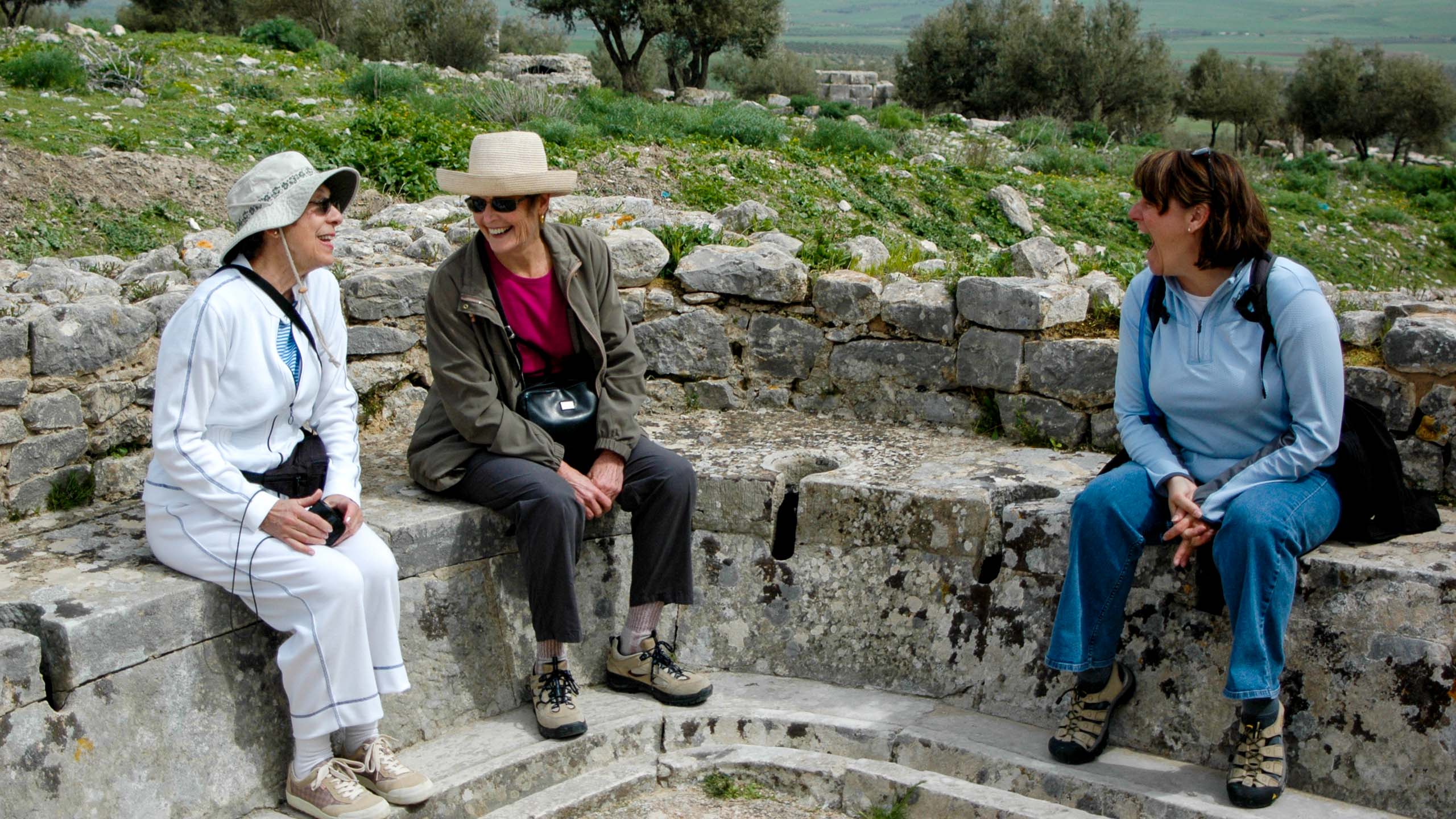 Three women laugh together in Tunisia