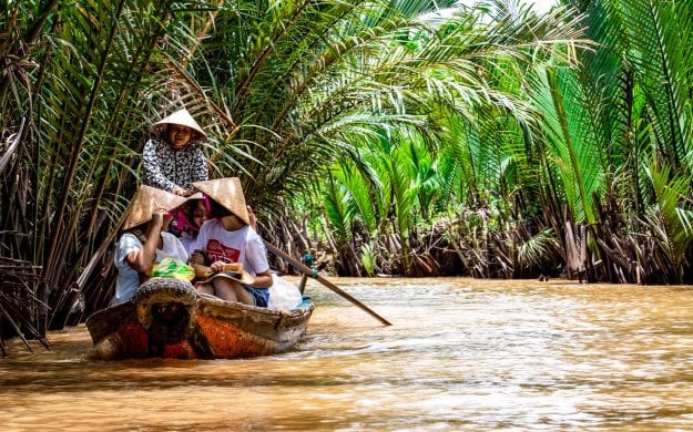 People in boat on Mekong River in Vietnam