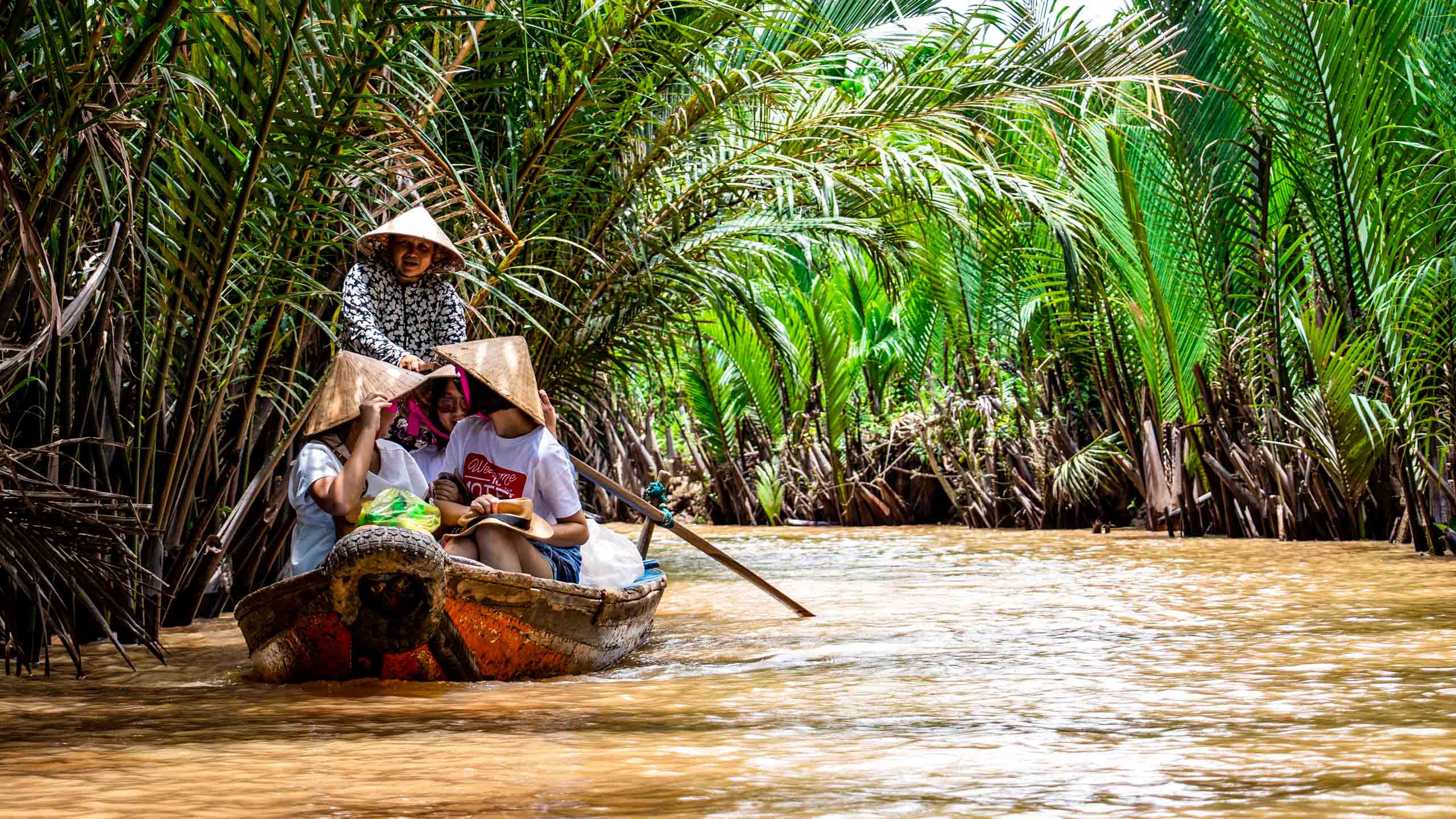 People in boat on Mekong River in Vietnam