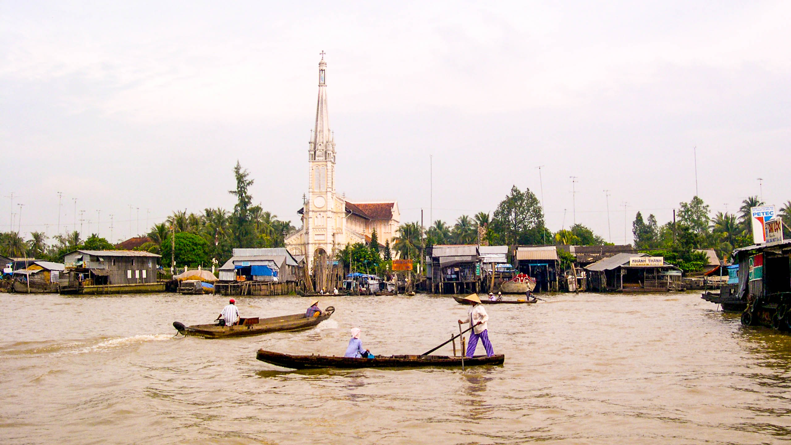 Vietnam boats on river near town