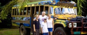 Weber family stands in front of Eco-Tour bus
