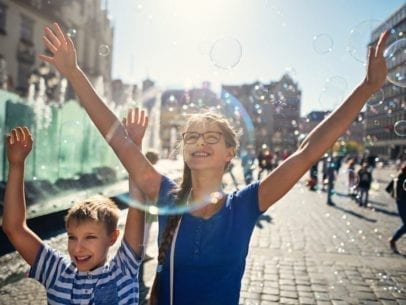 kids with bubbles in Polish town square